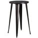 A round black Flash Furniture bar table with metal legs.