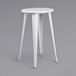 A Flash Furniture white metal cafe stool with legs.