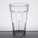 A close-up of a clear Cambro plastic tumbler with a black rim.