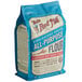 A blue Bob's Red Mill bag of unbleached all-purpose flour.