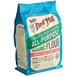 A blue bag of Bob's Red Mill Organic Unbleached All-Purpose Flour.