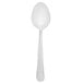 A Walco stainless steel dessert spoon with a white handle on a white background.