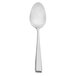 A Walco stainless steel dessert spoon with a silver handle and white background.