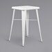 A Flash Furniture white metal bar height table with 2 backless square stools.