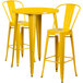 A Flash Furniture yellow metal bar table with two yellow bar stools.