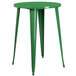 A Flash Furniture green metal bar height table with legs.