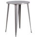 A Flash Furniture silver metal bar height table with a round top and legs.