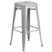 A silver metal Flash Furniture bar stool with a square seat.