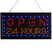 A rectangular white LED sign that says "Open 24 Hours" with red lights on it.