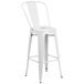 A white metal bar stool with a backrest.