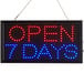 A rectangular LED sign that says "Open 7 Days" in red and blue lights.