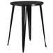 A Flash Furniture black metal round bar height table with 2 square seat backless stools.