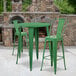 a green table and chair next to a fireplace