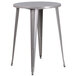 A Flash Furniture round metal bar height table with legs.