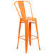 An orange metal bar stool with a seat.