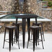 A Flash Furniture bar height table with four square seat backless stools on an outdoor patio.