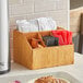 An American Metalcraft natural poplar wood coffee caddy on a counter.