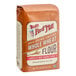 A 5-pound bag of Bob's Red Mill 100% stone ground whole wheat flour.
