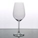 A Stolzle Bordeaux wine glass with a clear liquid inside.