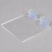 A clear plastic holder with two plastic clips.