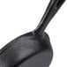 An American Metalcraft pre-seasoned mini cast iron skillet with a handle.