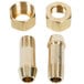 A close-up of two brass nuts on a metal tube.