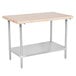 An Advance Tabco wood top work table with a stainless steel base and undershelf.