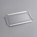 A white rectangular bottom shelf with metal parts.