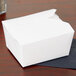 A white Fold-Pak Bio-Pak take-out box on a table.