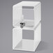 A white plastic cube with a clear lid and a faucet.