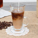 A Libbey Irish glass coffee mug filled with coffee and milk.