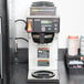 A Bunn Axiom DV-3 automatic coffee brewer on a counter.