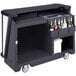 A black Cambro portable bar cart with bottles inside.