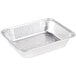 A close-up of a silver Western Plastics half size foil steam table pan with a square lid.