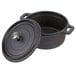 An American Metalcraft pre-seasoned black cast iron pot with a lid.