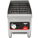 A Vollrath Cayenne charbroiler with a red flame on a metal grill.