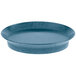 A blue oval deli server with a rim on a table.
