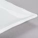 A bright white rectangular porcelain platter with a thin edge.