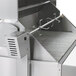 A stainless steel Crown Verity rotisserie assembly with grill racks.