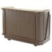 A brown Cambro portable bar with wheels.