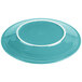 A turquoise plate with a white rim.