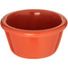 A Carlisle Sunset Orange smooth melamine ramekin.