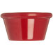 A close-up of a red Carlisle melamine ramekin.