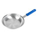 A silver Vollrath Wear-Ever frying pan with a blue handle.