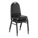 A black stackable banquet chair with a 2-inch padded seat and a silver vein frame.