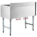 A large stainless steel Regency underbar ice bin with red tubes on legs.