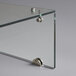 An Avantco glass sneeze guard shelf with metal screws.
