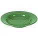 a green bowl with a circular surface