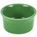 A green Fiesta ramekin with a white interior.