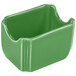 A green ceramic container with a curved edge.